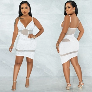 Detail of white sequined v-neck mini dress with mesh patchwork and rhinestone embellishments