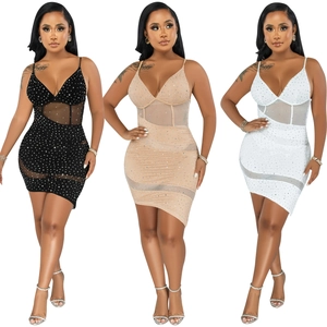 Close-up of mesh fabric with rhinestone details on an asymmetrical sexy V-neck dress