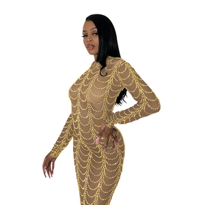 Detailed close-up of gold sequins and mesh texture on a sexy bodycon evening dress