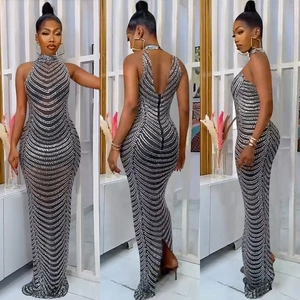 Three-way view of sequined evening gown with halter neck and backless fishtail silhouette