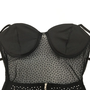 Detail of black polka dot mesh camisole with rhinestones and structured cups