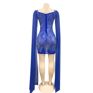 Macro shot of royal blue mesh floor-length sleeves with silver rhinestone patterns