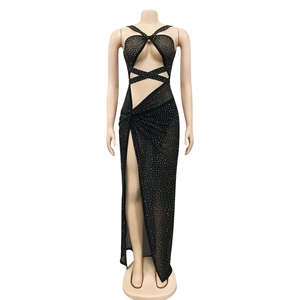 Detail of black sheer evening dress with rhinestones and sexy high side slit cutout