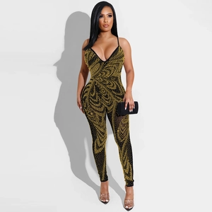Detail of slim-fit sexy mesh jumpsuit with V-neck and golden rhinestone patterns