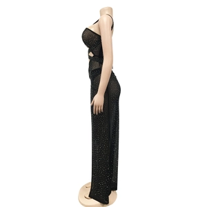 Detail of sheer black mesh dress with glittering rhinestones and side cut-out design