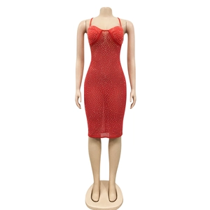 Close-up of red bodycon dress featuring shimmering rhinestones and a sweetheart neckline