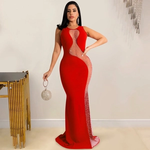 Detail of red sleeveless gown with mesh cutouts and white pearl rhinestone embellishments
