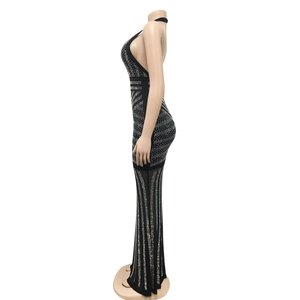 Detail of black backless evening dress featuring silver rhinestone geometric patterns