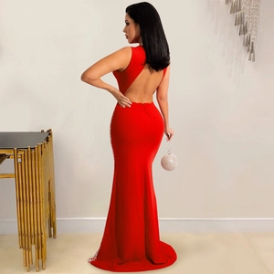 Detailed back view of a red backless mermaid dress featuring sparkling rhinestone accents