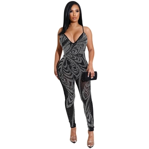 Detailed view of sexy black jumpsuit with silver rhinestones and plunging V-neck