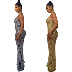 Elegant backless evening dress with silver and gold sequins and mermaid floor-length cut