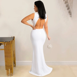 Detailed back view of white backless evening dress with rhinestone fishtail hem