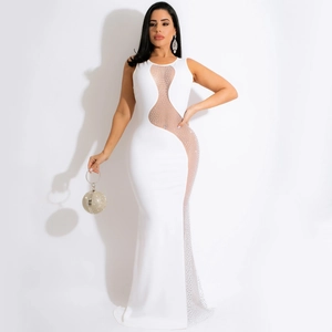 Detail of sheer mesh wave panels and shimmering rhinestones on white sleeveless dress