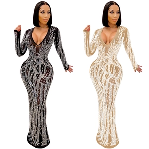 Detail of sheer mesh maxi dress with sparkling silver rhinestones and deep V-neckline
