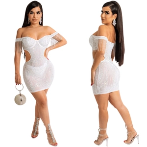 Detail of white off-shoulder mini dress with sparkling rhinestones and fringe sleeves