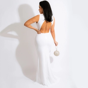 Detail view of a sexy backless white mesh dress with rhinestones and fishtail hemline