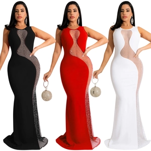 Detailed view of sheer mesh patchwork and sparkling rhinestones on slim fit evening gowns