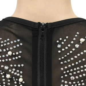 Detail of black mesh dress with silver rhinestones and pearls near the back zipper