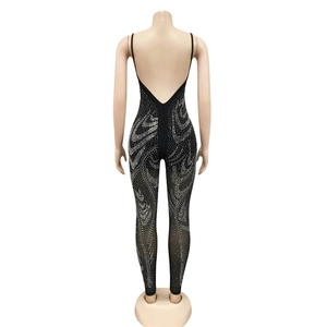 Close-up of black mesh bodysuit with silver rhinestones and deep V backless design