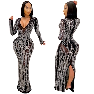 Detail view of the deep V-neck and silver rhinestone patterns on mesh evening dress