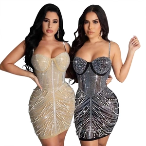 Detail of sequined bodycon mini dress with luxury rhinestones and pearls embroidery