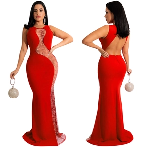 Close-up of red rhinestone fishtail dress featuring mesh patchwork and backless design