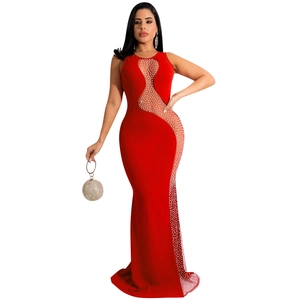 Detail of red sleeveless fishtail gown with wave-shaped mesh and pearl embellishments