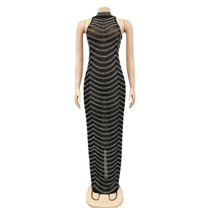 Detail of black halter neck mesh dress with wavy white rhinestone and sequin embellishments