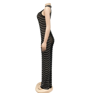 Detail view of wave pattern white rhinestones on a backless black evening party dress
