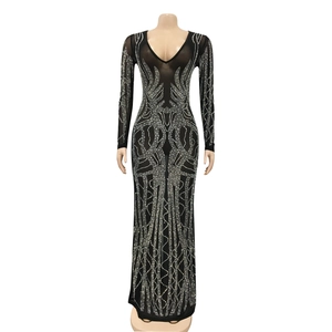 Detailed view of shimmering rhinestones on black sheer mesh long sleeve formal dress