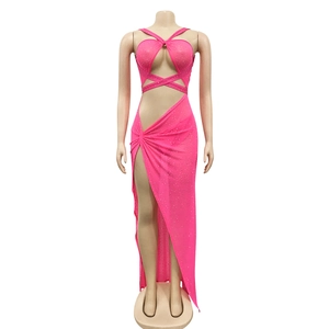 Detail of hot-fix rhinestones on a pink mesh two-piece dress with high side slit