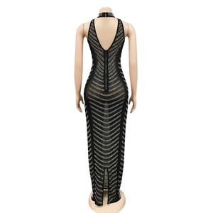 Detail of back zipper closure on black backless evening dress with rhinestones