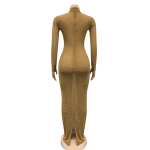 Detail view of the back zipper and slit on a sheer mesh rhinestone maxi dress