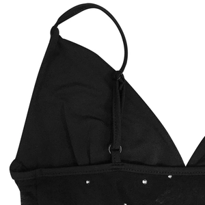 Detail of adjustable straps and sparkling rhinestones on sheer mesh black evening dress