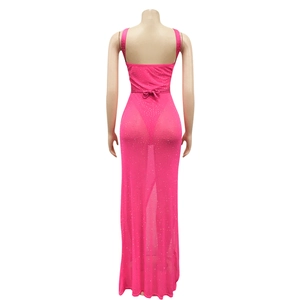 Detail of hot-fix rhinestones on a pink mesh dress with an elegant bow back design