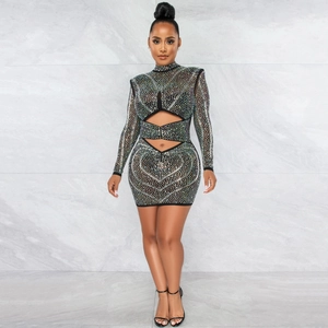 Detail of sheer black mesh dress featuring colorful rhinestones and side cut-outs