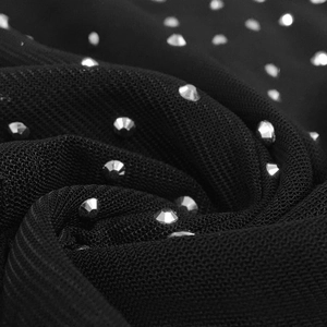 Detailed macro shot of black mesh fabric featuring sparkling silver rhinestones for a dress