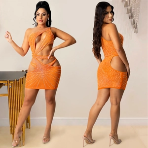Detail view of orange rhinestone mini dress with hollow out design and one shoulder style