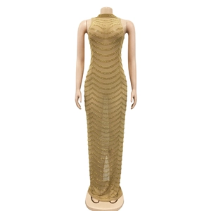 Close-up of golden sequins and wave pattern details on a mesh luxury evening dress