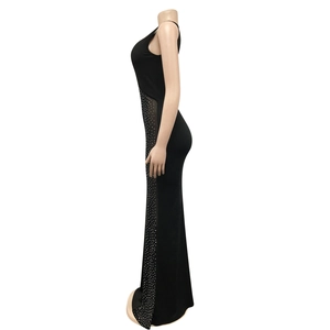 Detail of sheer mesh side panels with sparkling rhinestones on a black maxi dress