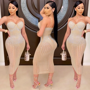 Sparkly champagne gold bodycon rhinestone dress with thin straps and a deep heart neckline