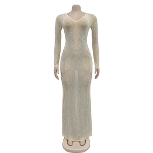 Detailed view of silver rhinestones in swirl patterns on a mesh long sleeve evening dress