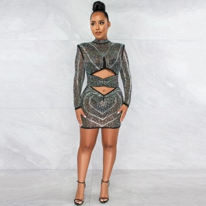 Detail view of sparkly rhinestones and sexy waist cutouts on this black mesh dress