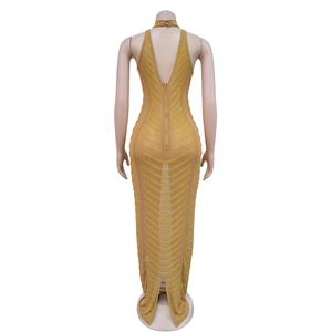 Detail of back view showing hidden zipper and gold rhinestones on backless nude evening dress