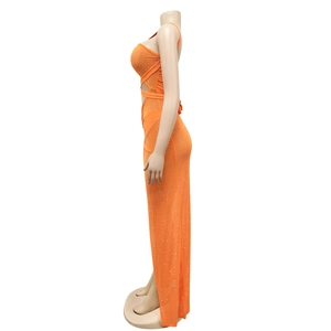 Detail of orange mesh maxi dress with sparkling rhinestones and side cutout design