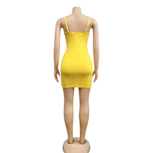 Detail view of the yellow bodycon mini dress showing the spaghetti straps and hidden zipper