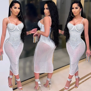 Close-up of white mesh midi dress featuring corset bodice and sparkling rhinestone stripes