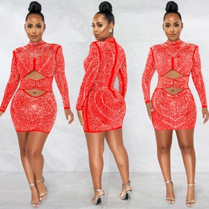 Detail of red bodycon mini dress with rhinestones and waist cut-out mesh design