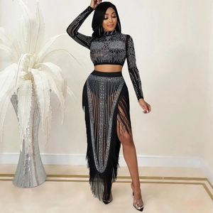 Sexy black mesh two-piece set with long sleeves, rhinestones, and long tassel skirt