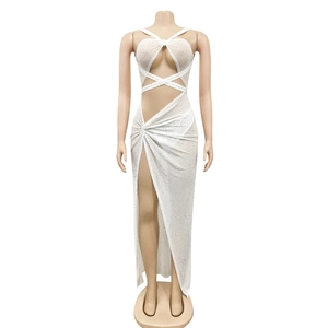 Detail of white mesh dress with rhinestones featuring waist cut-out and high slit